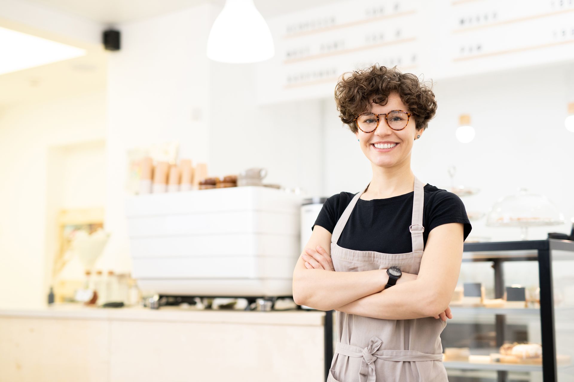 attractive-female-barista-in-coffee-shop-PCW6G7S.jpg